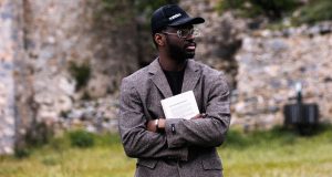 How To Have a Mind of Your Own A confident black man wearing a blazer and face cap, standing outdoors with folded arms and looking to the right, symbolizing self-assurance and independence — a perfect visual for how to have a mind of your own.