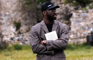 How To Have a Mind of Your Own A confident black man wearing a blazer and face cap, standing outdoors with folded arms and looking to the right, symbolizing self-assurance and independence — a perfect visual for how to have a mind of your own.