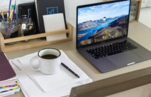 The Best Business Ideas For 2025 and Beyond Minimal workspace setup with laptop, coffee, and notepad representing business planning and entrepreneurship since 2023, highlighting the best business ideas for 2025.