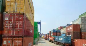 Dropshipping Products That Will Make You A Millionaire Shipping containers stacked at a busy seaport labeled “Oceanic,” symbolizing global trade, logistics, and dropshipping products that will make you a millionaire.