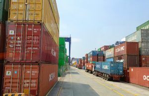 Dropshipping Products That Will Make You A Millionaire Shipping containers stacked at a busy seaport labeled “Oceanic,” symbolizing global trade, logistics, and dropshipping products that will make you a millionaire.