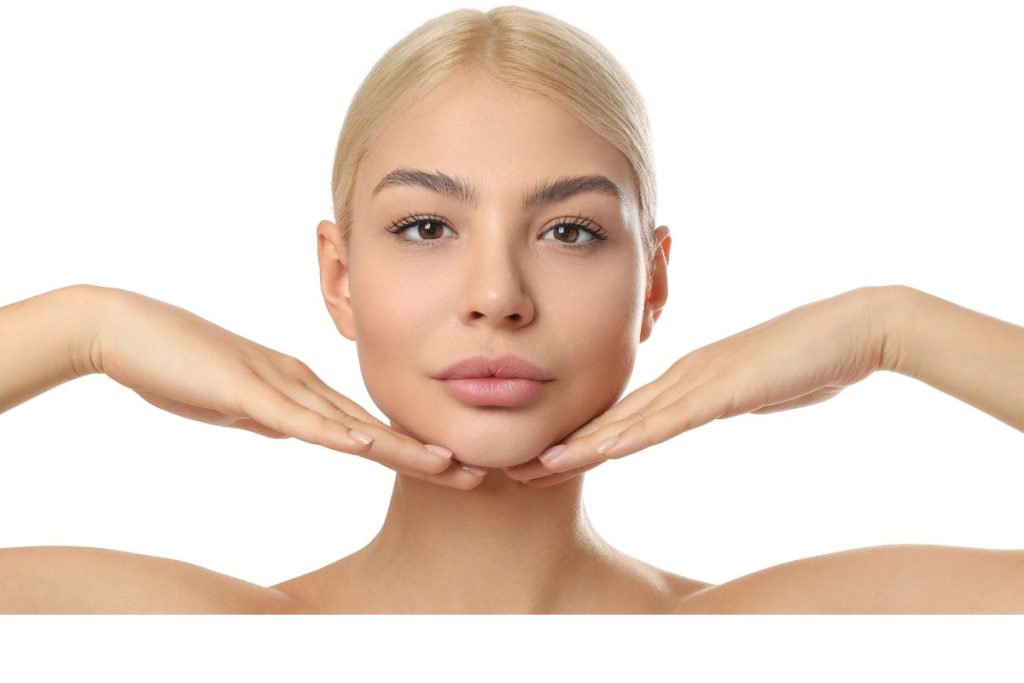 Pretty woman showing clear, healthy skin, demonstrating easy beauty tips you can do at home for glowing skin