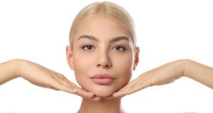 10 Easy Beauty Tips You Can Do at Home for Glowing Skin Pretty woman showing clear, healthy skin, demonstrating easy beauty tips you can do at home for glowing skin
