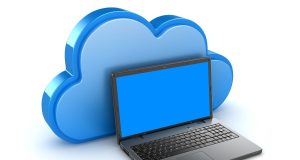 Simple Guide to Understanding Cloud Storage and How It Works Laptop with a large cloud icon in the background, representing a simple guide to understanding cloud storage and how it works
