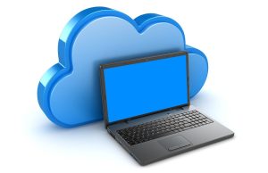 Simple Guide to Understanding Cloud Storage and How It Works Laptop with a large cloud icon in the background, representing a simple guide to understanding cloud storage and how it works