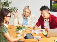 How To Turn Your Passion Into a Profitable Side Hustle Three entrepreneurs brainstorming business ideas while learning how to turn your passion into a profitable side hustle.