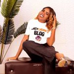 Start here with JacyLaura Blog - JacyLaura smiling in studio wearing blog t-shirt